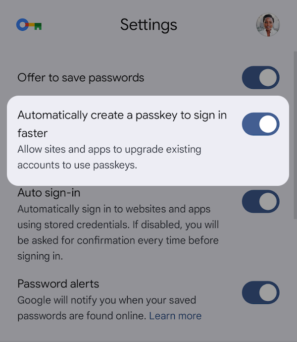 Google Password Manager settings showing a toggle for automatic passkey creation